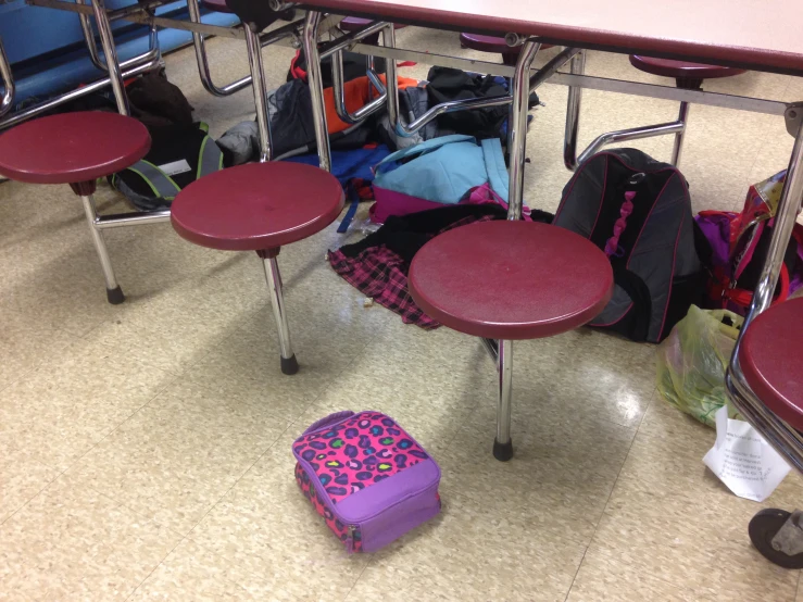 a bunch of luggage is sitting in a row on the ground