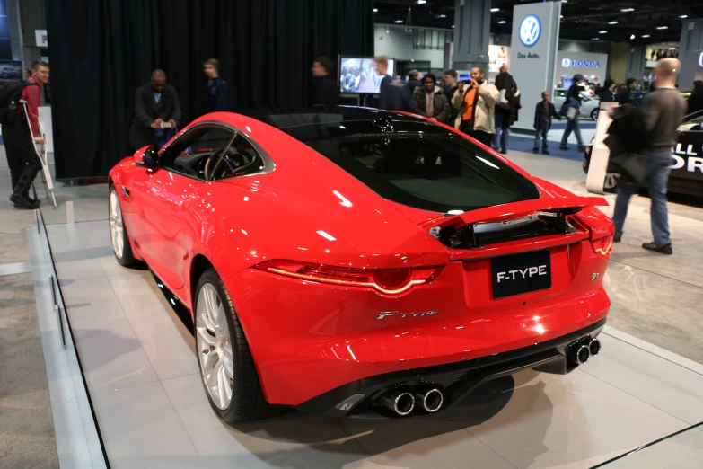 the front end of a red sports car on display