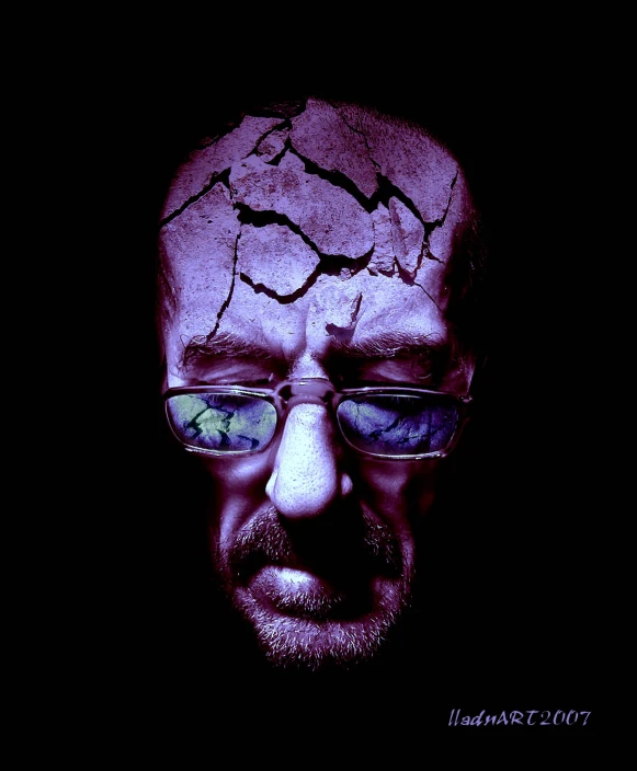 a po of a man with glasses in a dark room