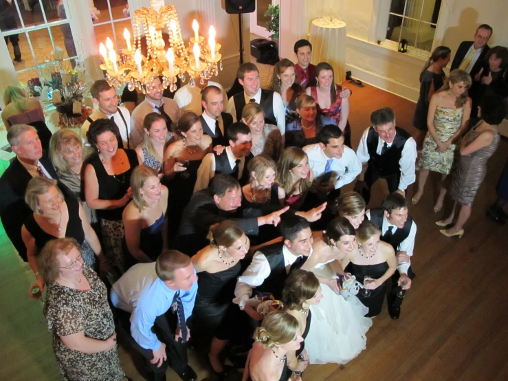 a wedding party is dancing at a hall