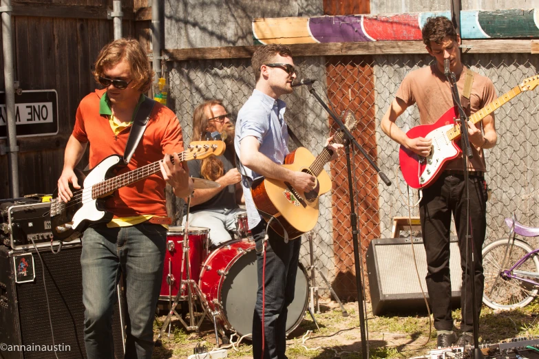 a band plays music on a small court yard