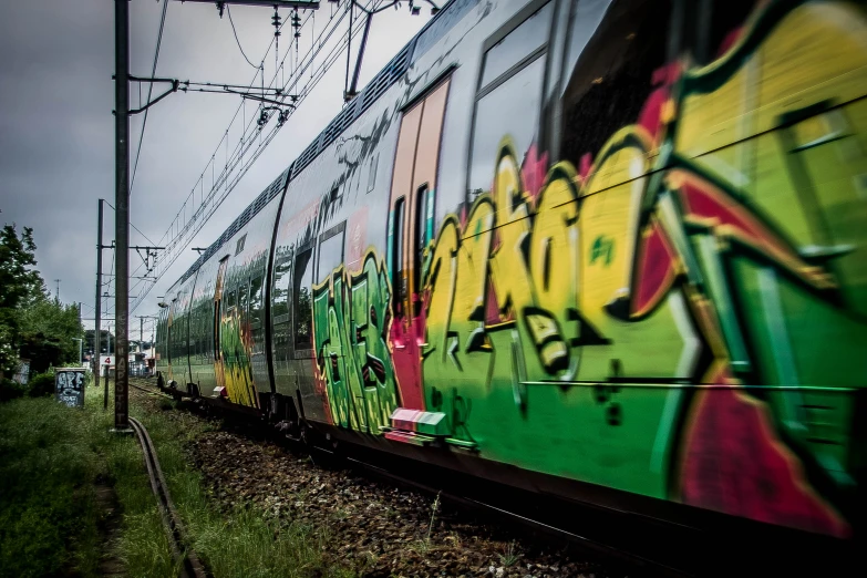 there are many train cars with graffiti on them