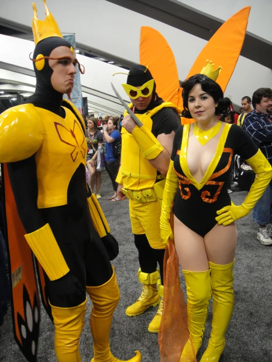 some people in costumes standing on a carpet