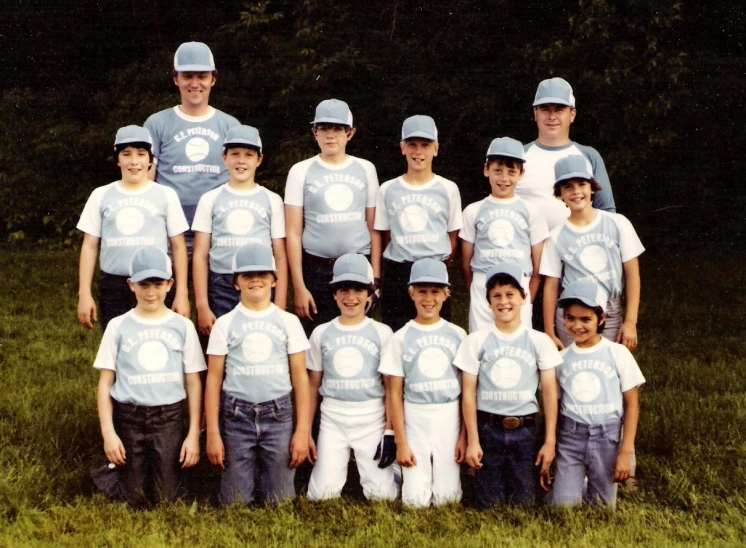 there is a group of boys and their families posing for a picture