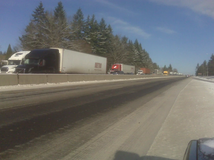 a view of a road with snow on the ground