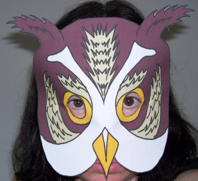 woman with bird mask decorated with feathers