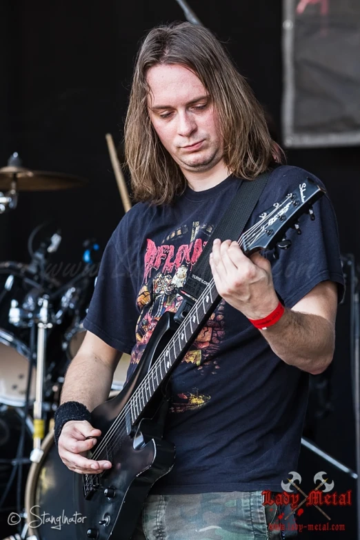 a young man playing an electric guitar with his instrument