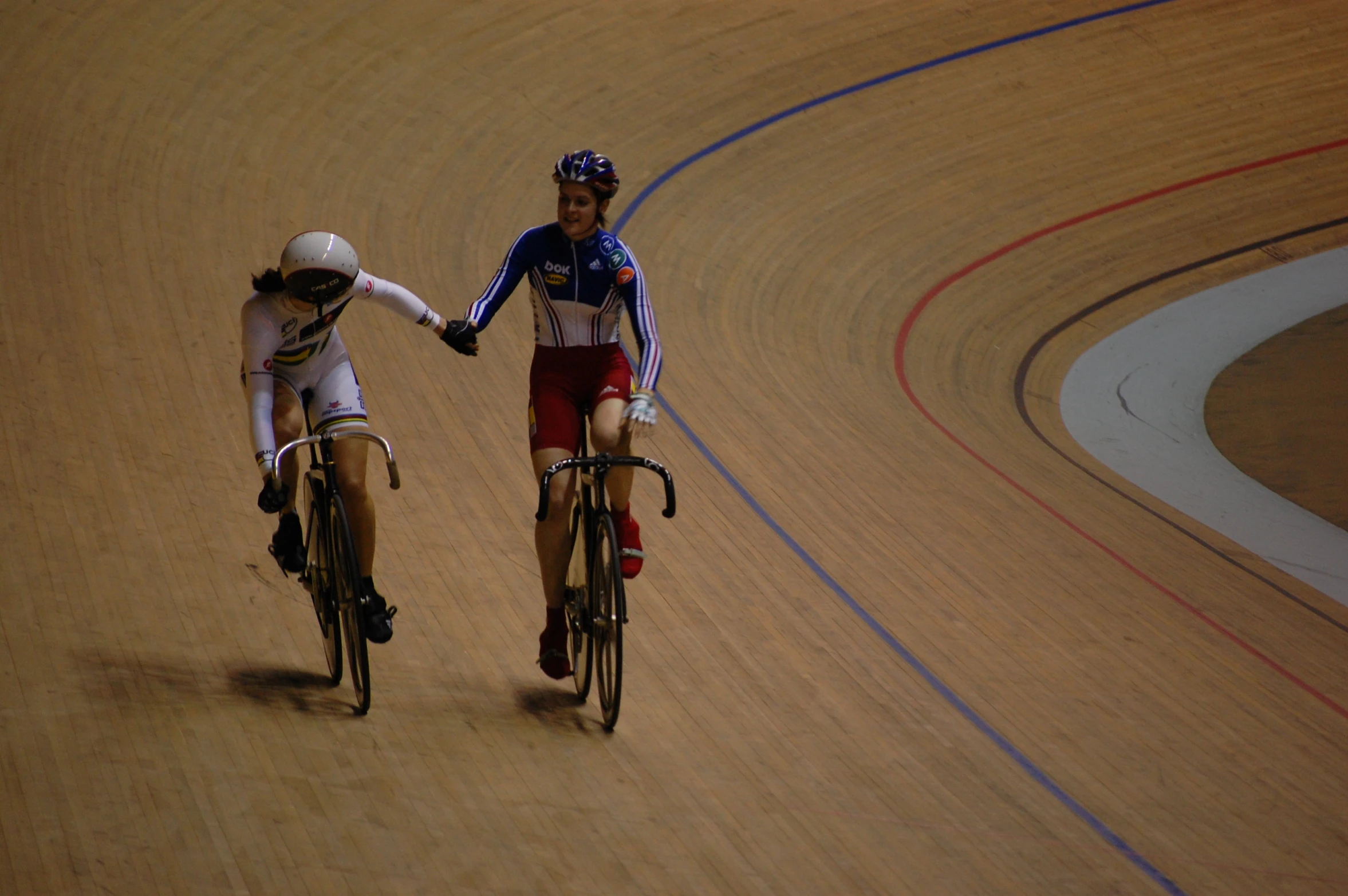 two people on bikes talking to each other