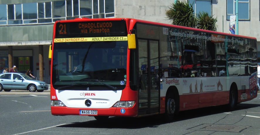 the large bus has multiple numbers and colors