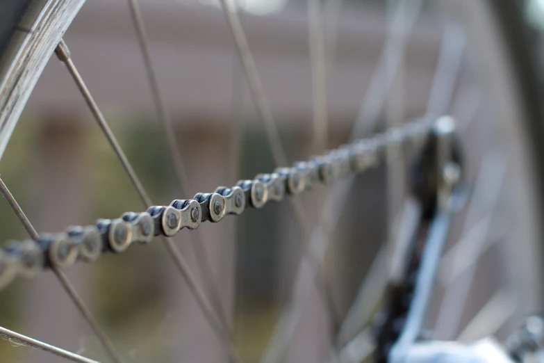 the spokes of a bicycle's wheels are covered in tinks