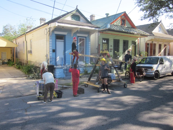 people on a sidewalk with musical equipment on the street