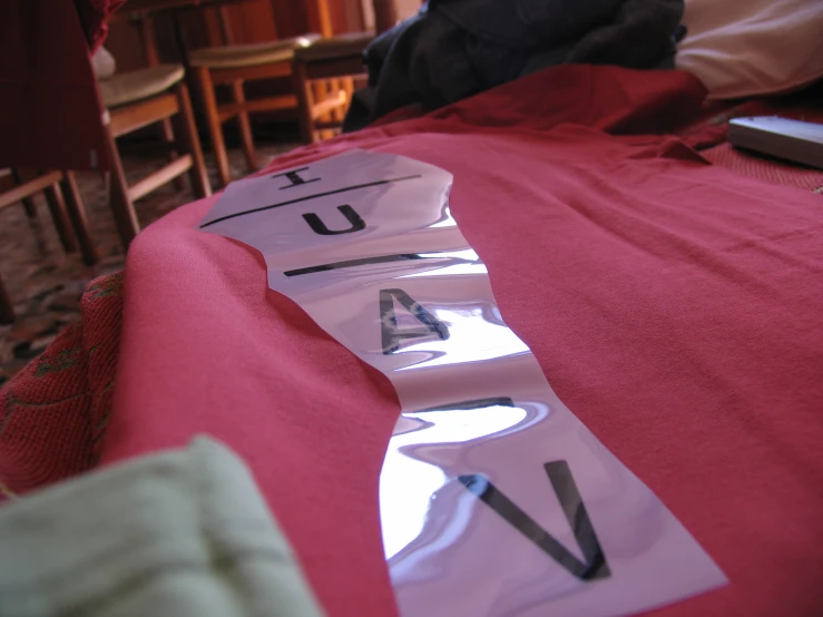 some stickers on the neck of a shirt