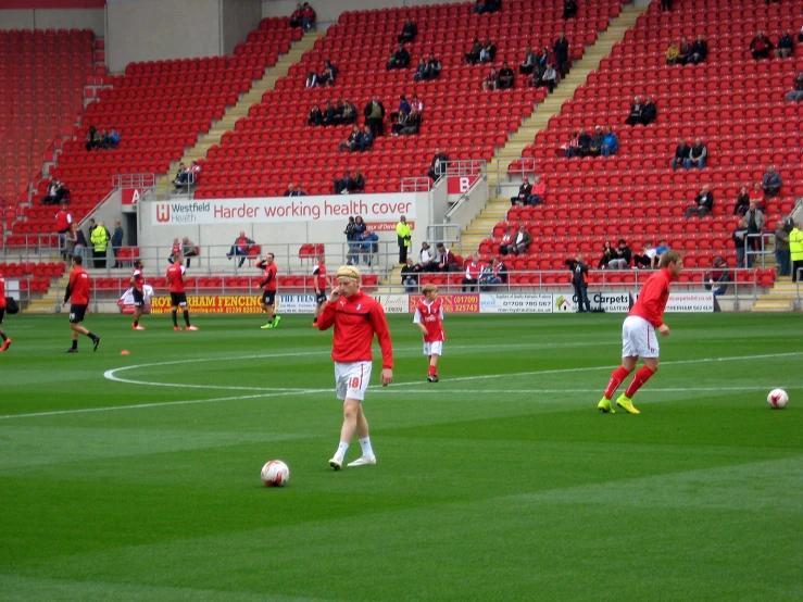 several soccer players are playing on a field