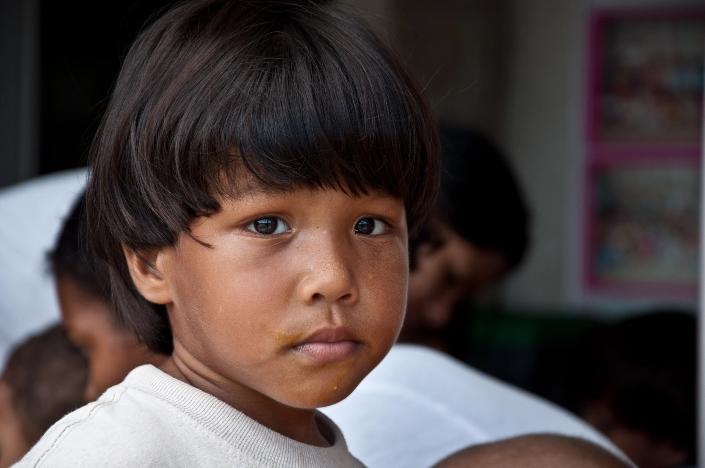 an up close po of a child looking directly into the camera