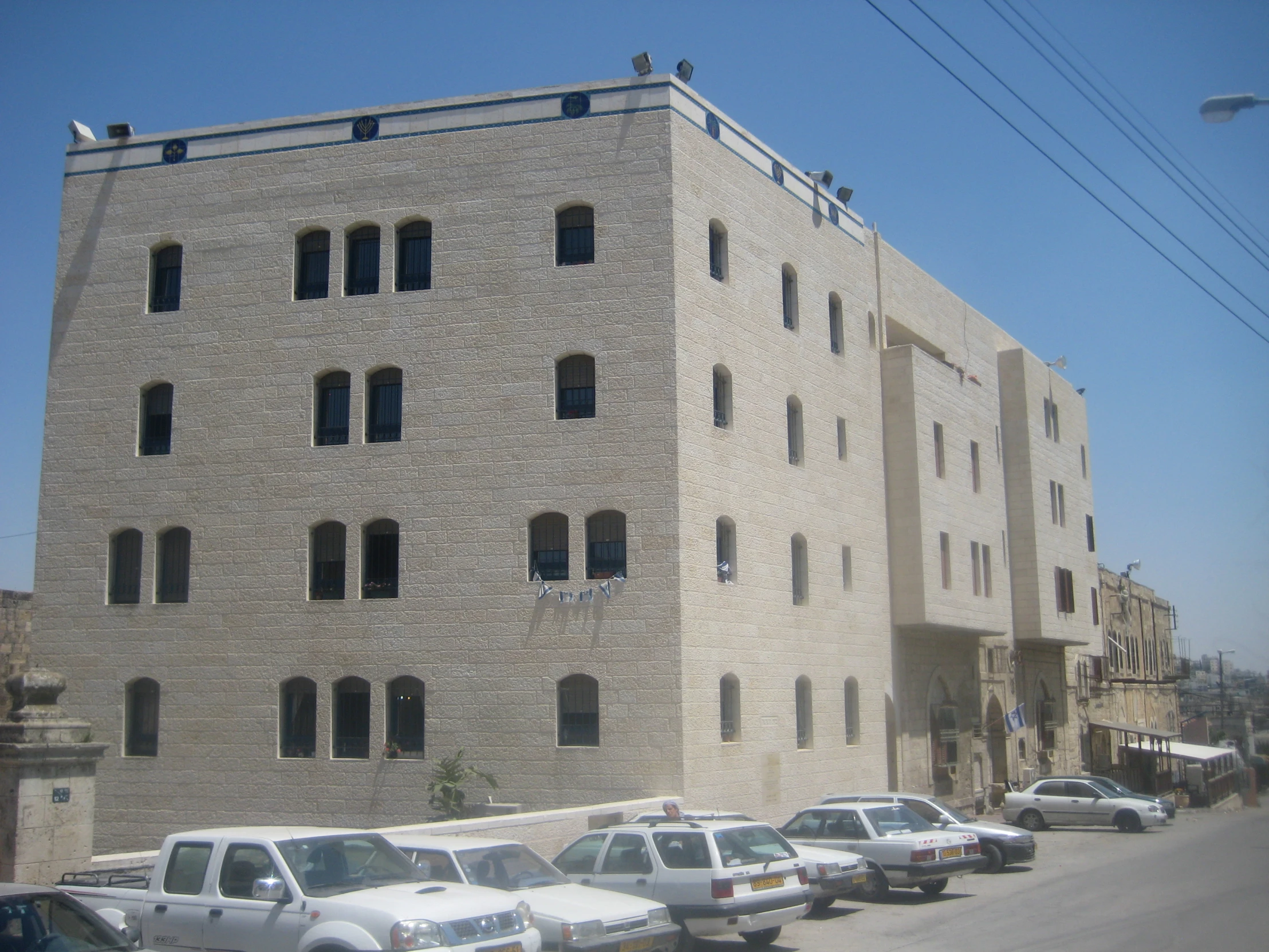 the large white building has many windows
