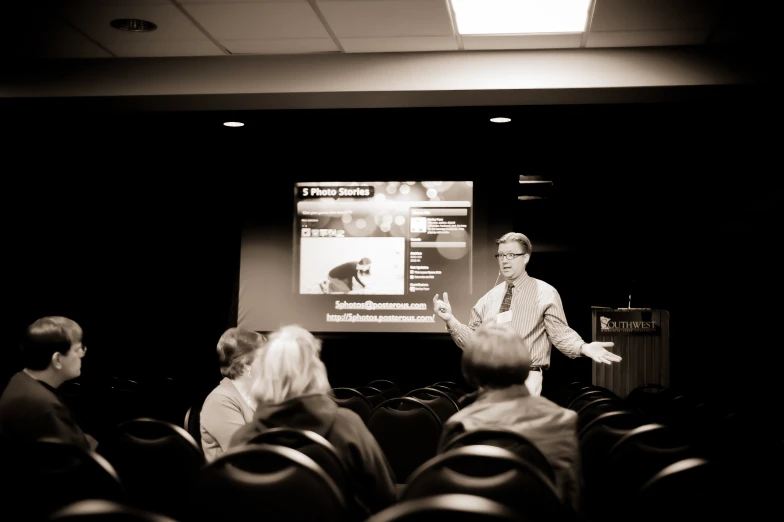 people in a theater watching a presentation