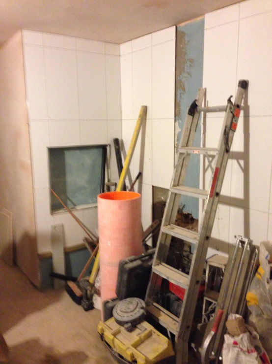 a view inside of a building with a ladder and tools