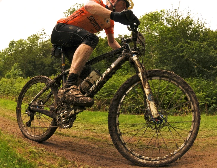 a man on a bike in a field