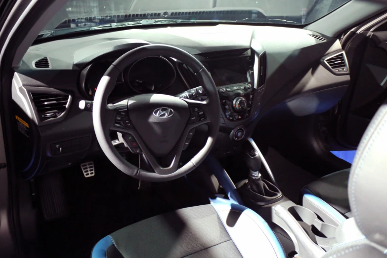 a close up view of the steering wheel, center console and interior of a vehicle