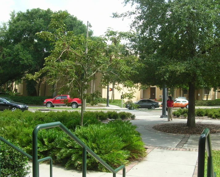 two cars are parked on the opposite street