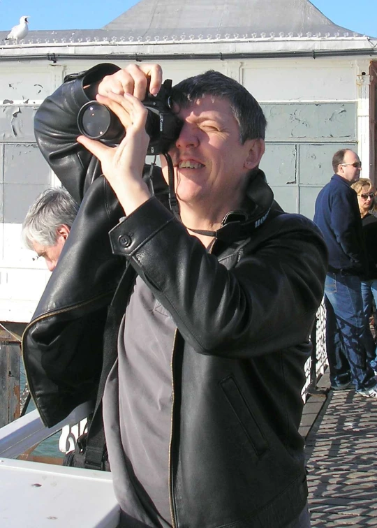 a man taking pictures while on a boat