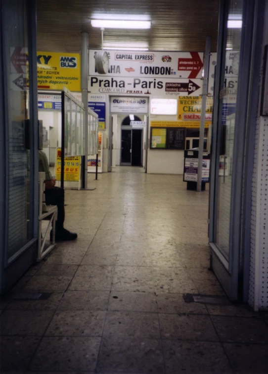 an empty lobby with various signage on the walls