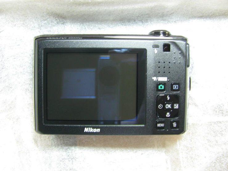 an old portable tv on a white surface