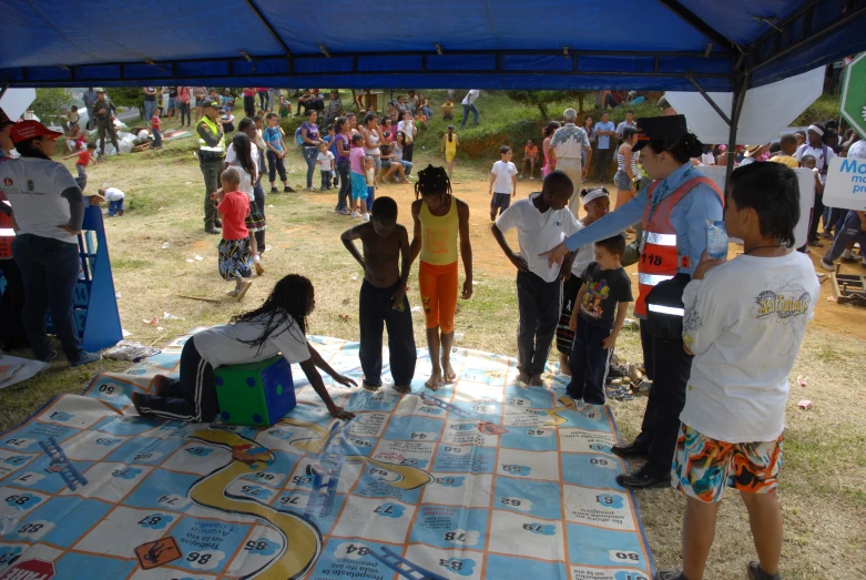 children on the ground at an outside event