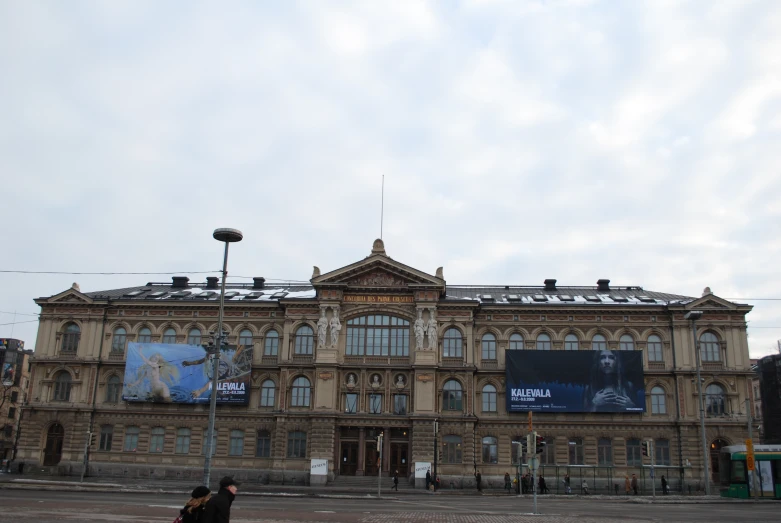 a building with windows sitting in front of it on a cloudy day