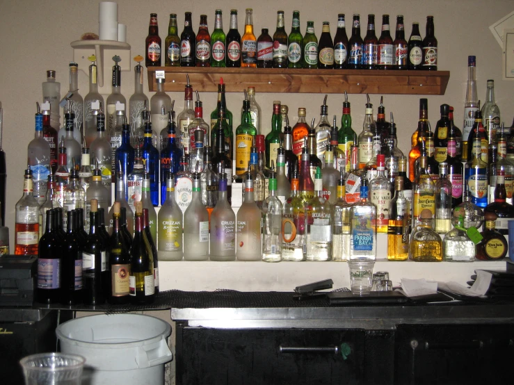 several bottles are sitting on top of the bar