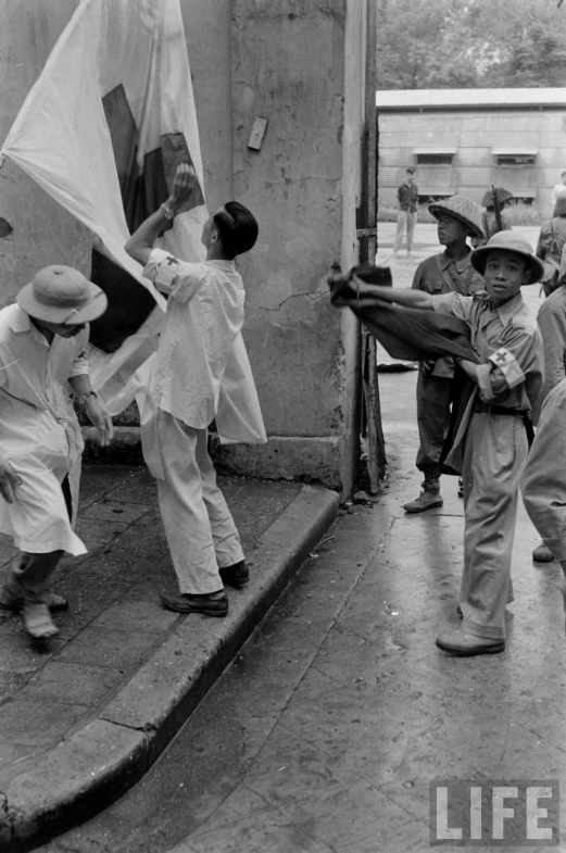 several children playing with an old fashioned toy