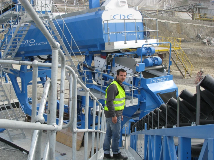 the worker is checking out the type of machine to take out the liquid