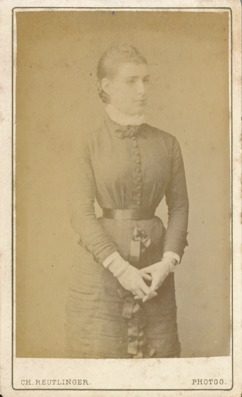 an old po of a young woman dressed in period clothing