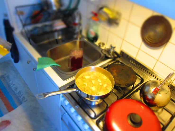 a counter top with a pot and pan on the stove