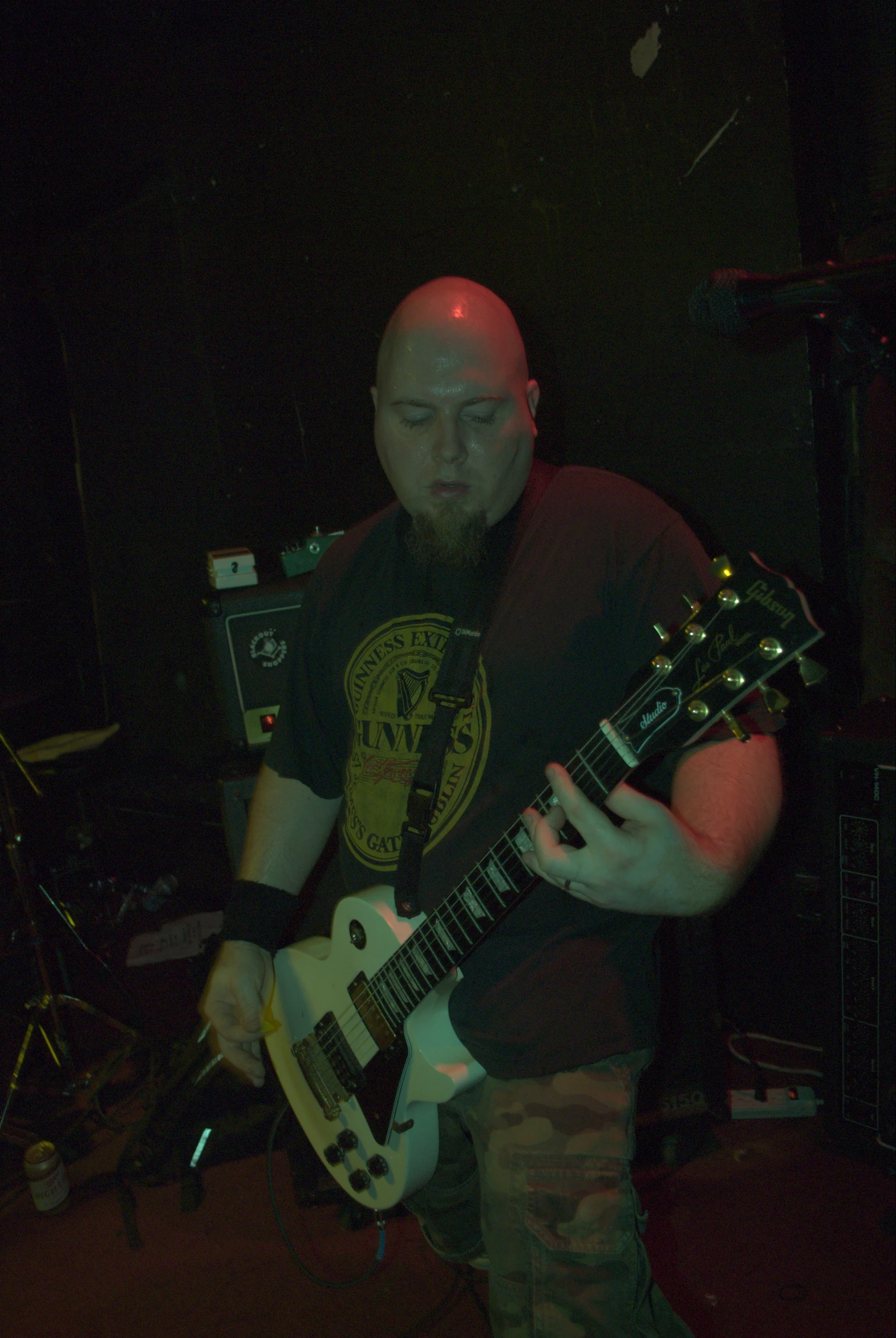 a man playing a guitar on stage