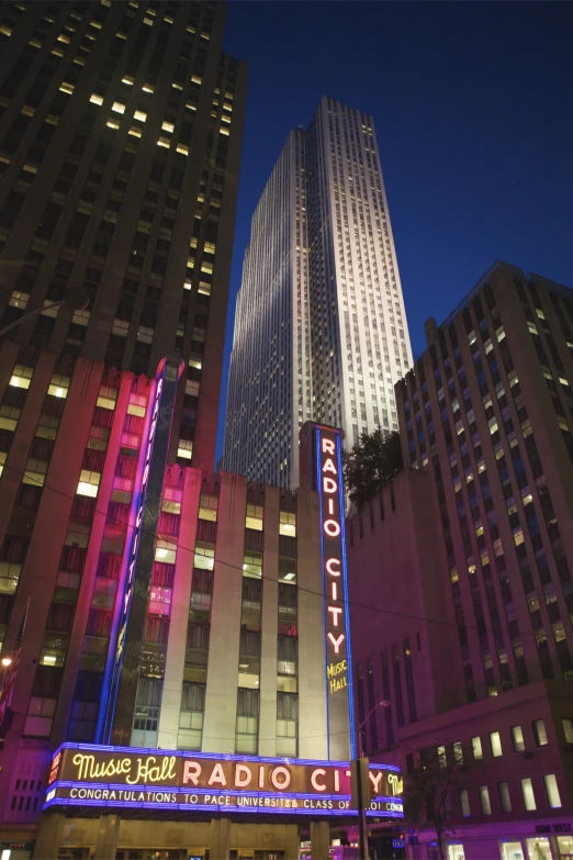 a cityscape with a theatre called radio city