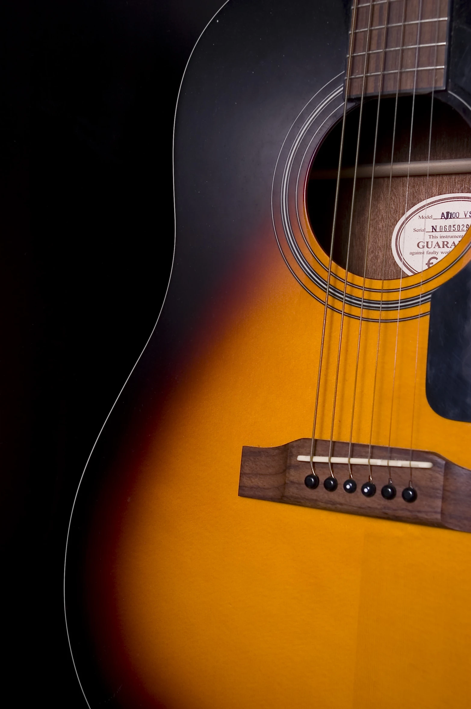 an acoustic guitar in the shape of a guitar neck