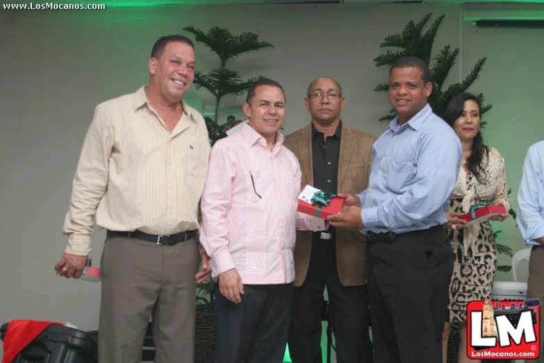 a group of people smiling for the camera while posing for the camera