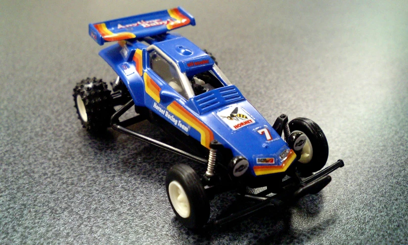 a toy remote control car with a blue engine