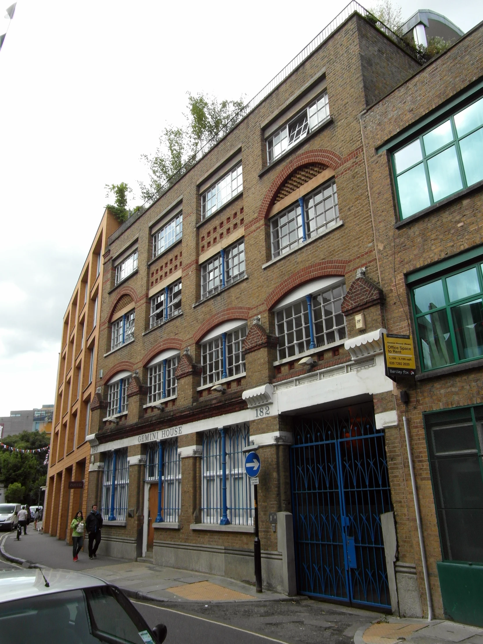 an old brick building with a few doors