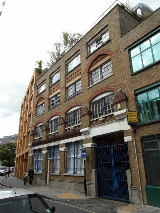 an old brick building with a few doors