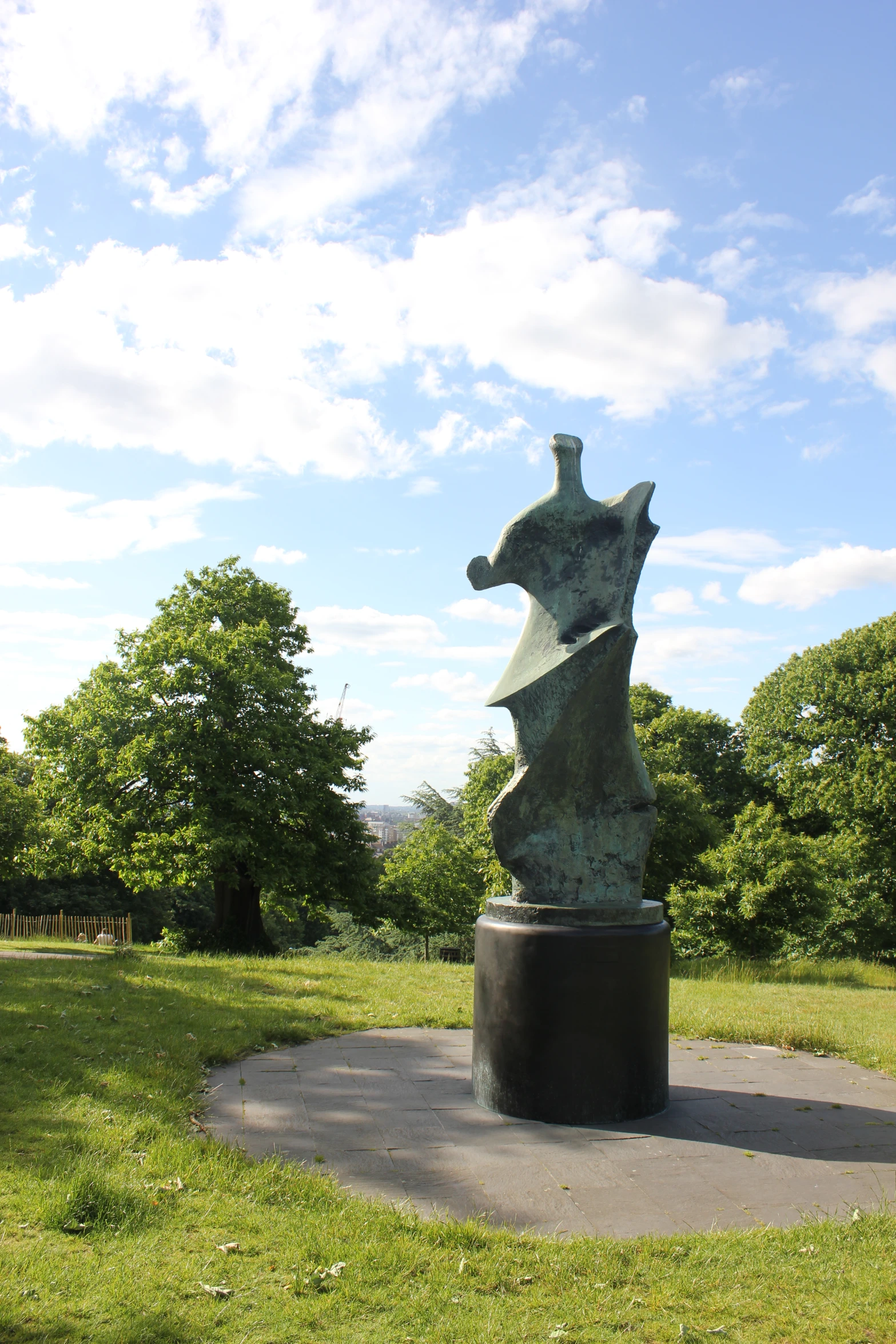 there is a sculpture in a park with a sky background