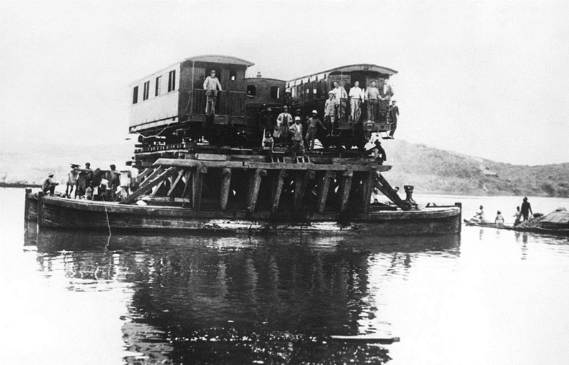 black and white po of a group of people on a barge