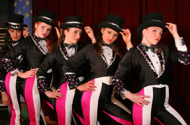 a group of people wearing costumes and hats