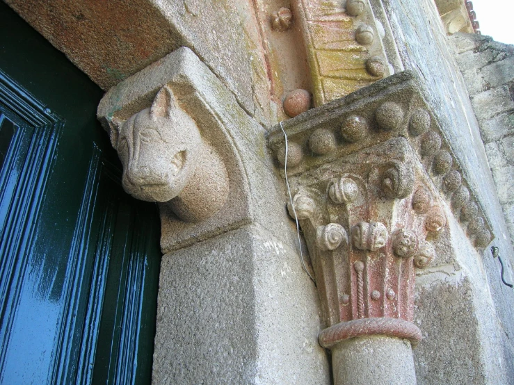 a decorative architectural column against an ornate building