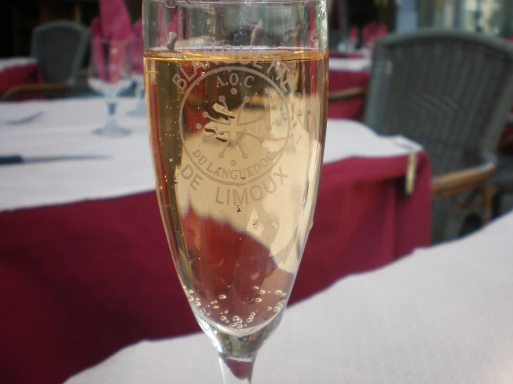 a close up of a wine glass filled with liquid