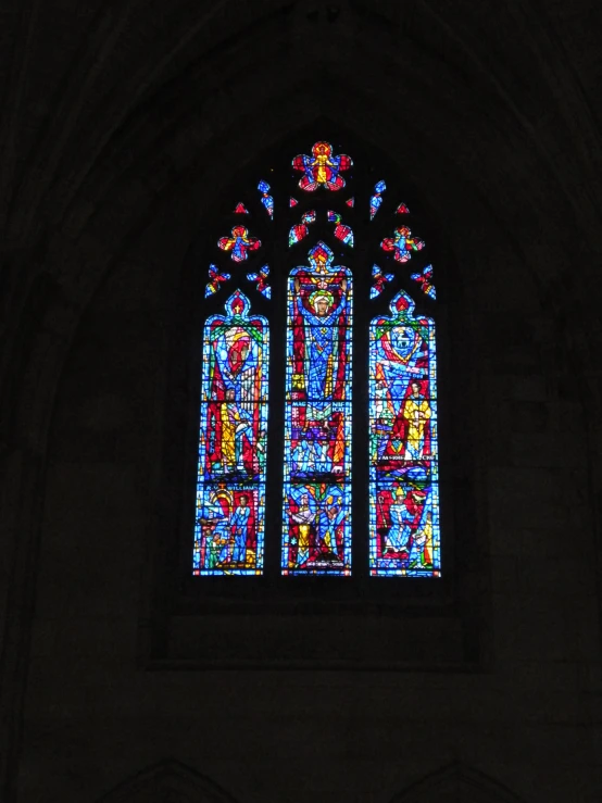 the large stained glass window is in a cathedral