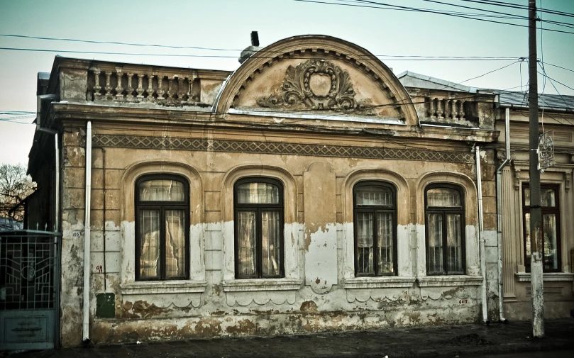 an old, run down building is seen in color