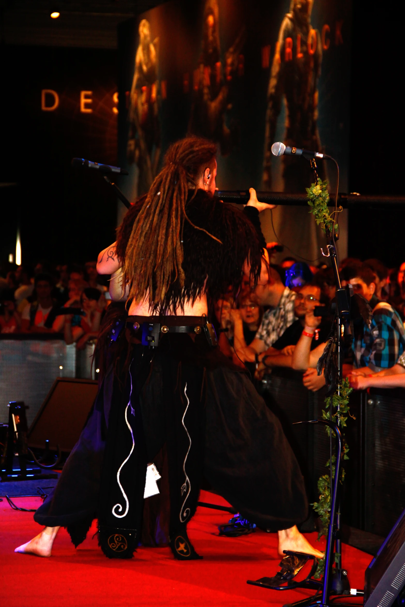 a woman on a runway dancing on stage