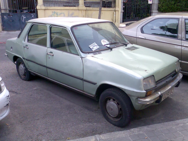 a small car that is sitting in the street